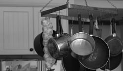 Hanging Pans in Kitchen by रोकावट के लिया खेद