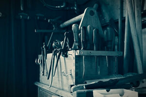 Vintage wooden toolbox filled with tools for woodworking