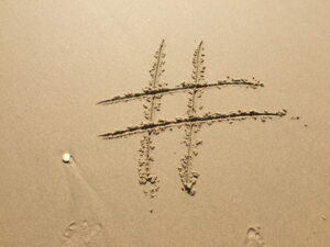 Hashtag mark drawn in the sand