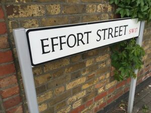 A white sign with black text labeling the path as Effort Street (SW17)